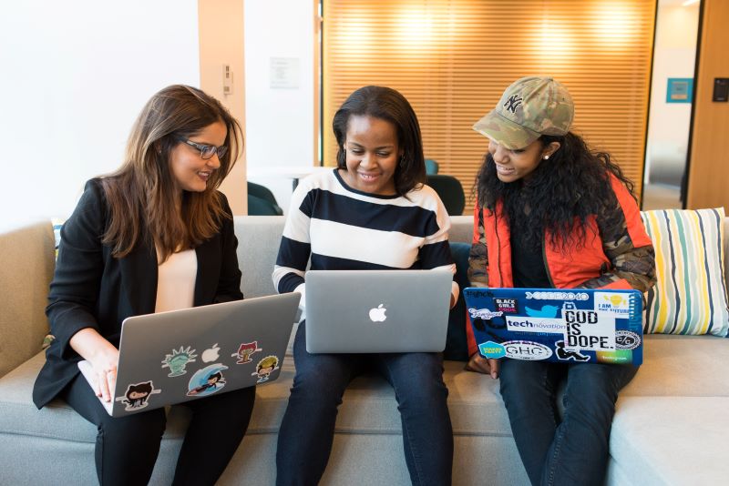 women with laptops searching the web